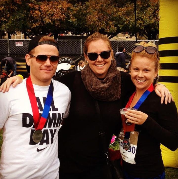 The author, right, with her brother and cousin after completing the Chicago Marathon.