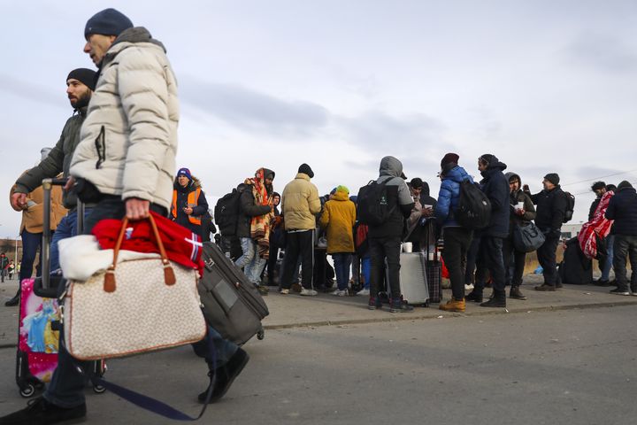Civilians are seen after crossing Ukrainian-Polish border due to the ongoing Russian attacks and conflict, in Medyka, Poland on March 1, 2022