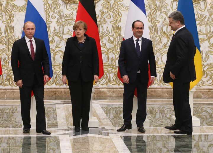Russian president Vladimir Putin, German chancellor Angela Merkel, French president Francois Hollande and Ukrainian president Alexander Lukashenko pose for a photo during the Minsk summit in 2015.