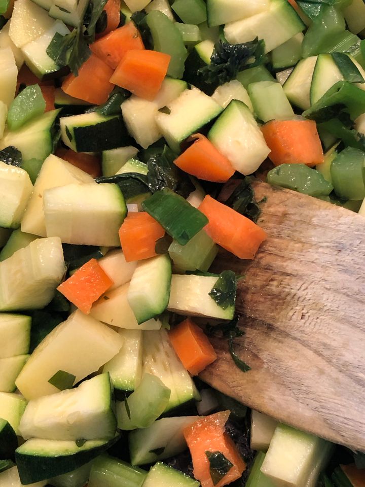 A variety of vegetables diced and prepared for soup