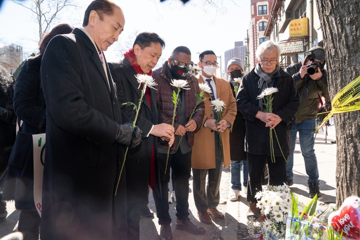 Asian American community leaders place flowers on a memorial for murder victim Christina Yuna Lee after an anti-Asian hate rally in Sarah D. Roosevelt Park on Feb. 15, 2022, in New York.