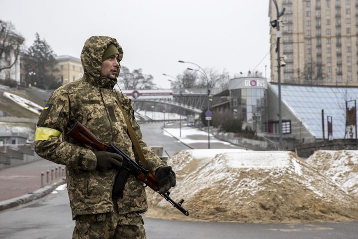 A soldier is seen around piles of sand used for blocking a road in Ukrainian capital, Kyiv amid Russian attacks on March 02, 2022. 