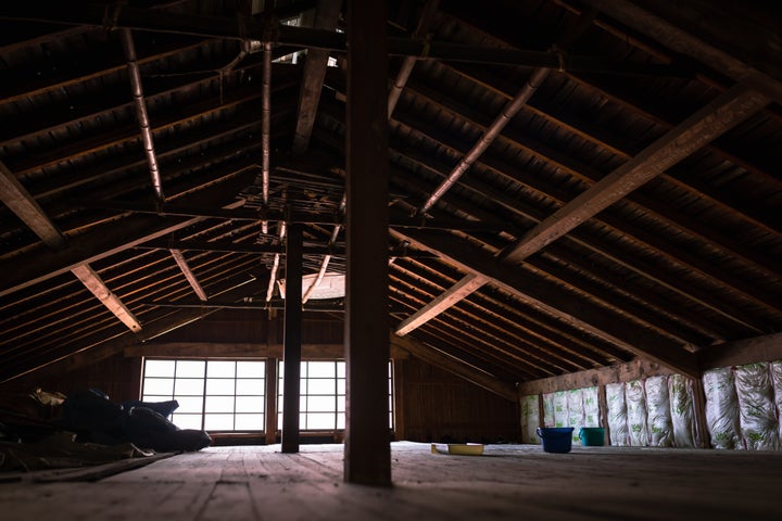 Men renovating an old house in rural Japan.