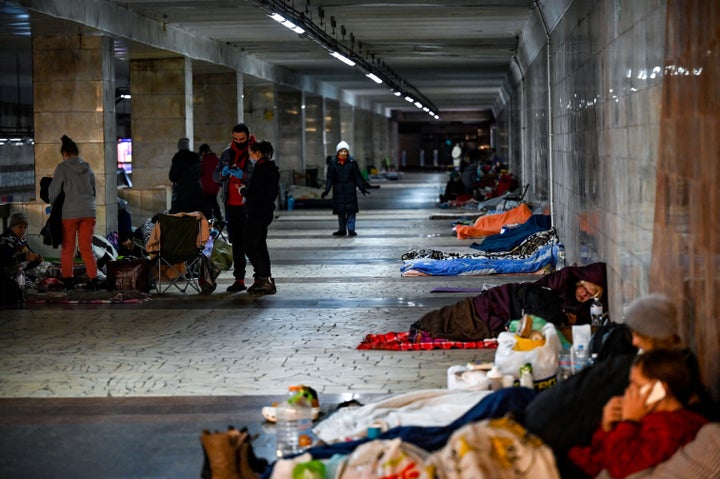 Civilians take shelter at an underground metro station in Kyiv on March 2, 2022