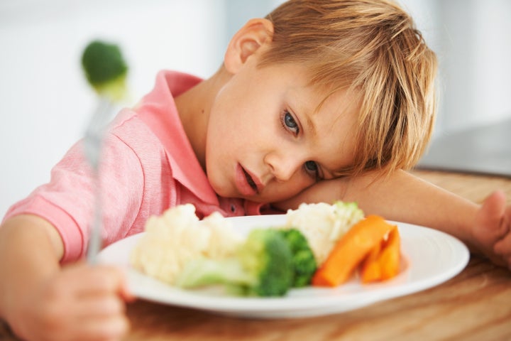 He's not happy about the texture of that broccoli.