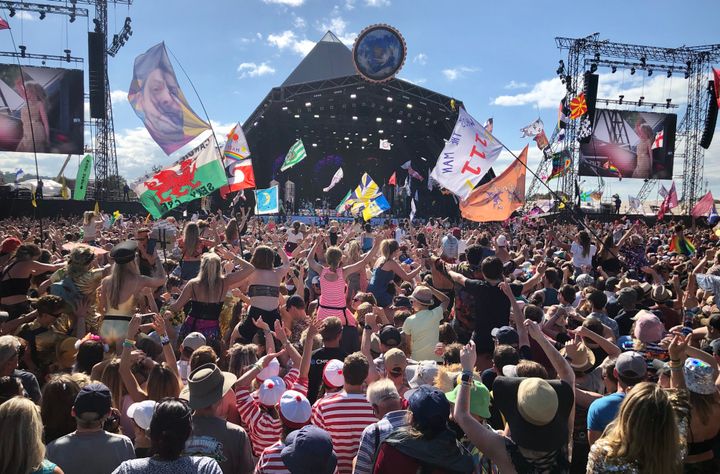 Crowds listen to Kylie perform on the Pyramid Stage at the 2019 Glastonbury Festival in 2019.
