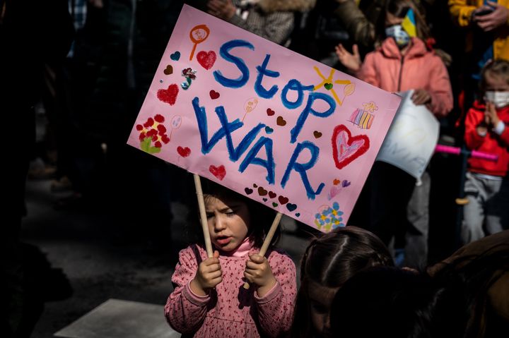 A young girl in Madrid carrying a placard during a Feb. 27 demonstration against the Russian invasion of Ukraine.