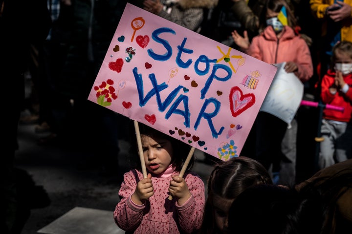 A young girl in Madrid carrying a placard during a Feb. 27 demonstration against the Russian invasion of Ukraine.