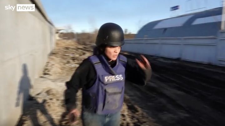 A Sky News journalist flees with her colleagues from a barrage of bullets near Ukraine's capital city, Kyiv.
