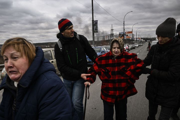 Residents evacuate the city of Irpin, northwest of Kyiv, during heavy shelling on March 5.