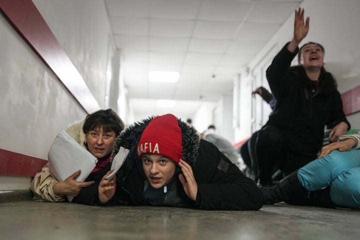 People hit the floor of a hospital during shelling on March 4.