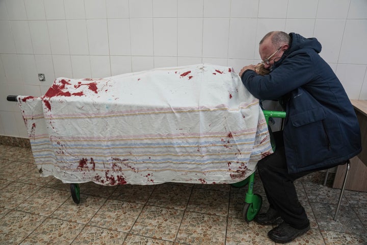 Serhii, father of teenager Iliya, cries over his son's lifeless body on March 2 at a maternity hospital converted into a medical ward.