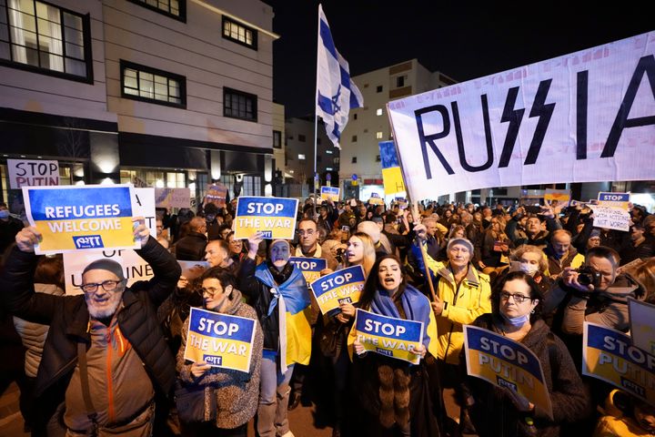 People hold placards during a protest against the Russian invasion of Ukraine while outside the Russian Embassy in Tel Aviv, Israel, on Saturday.