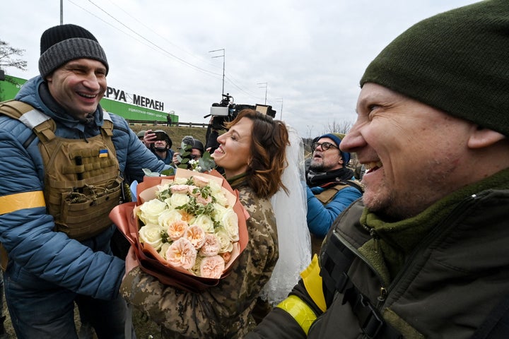 Kyiv Mayor Vitali Klitschko congratulates the newlyweds.