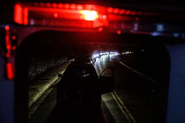 A line of vehicles is seen at Joint Base Andrews, in Maryland on Sunday after the base went into lockdown.