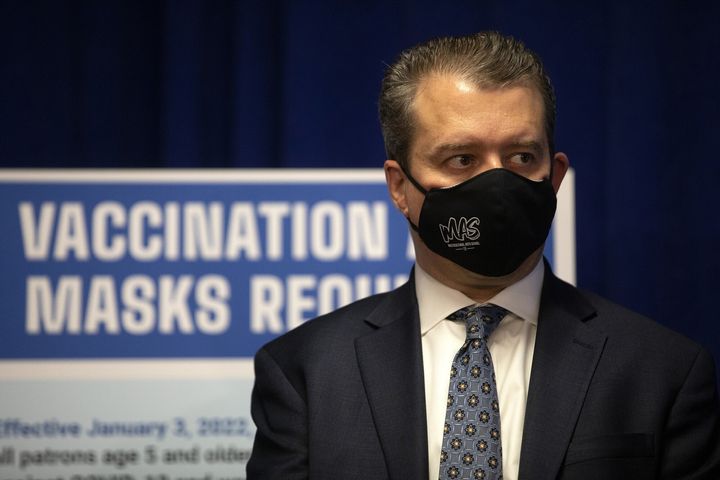 Chicago Public Schools CEO Pedro Martinez listens to a public health announcement by Chicago Mayor Lori Lightfoot on Dec. 21, 2021. CPS said it will stop requiring face masks for staff and students in the nation’s third-largest school district starting March 14, 2022.