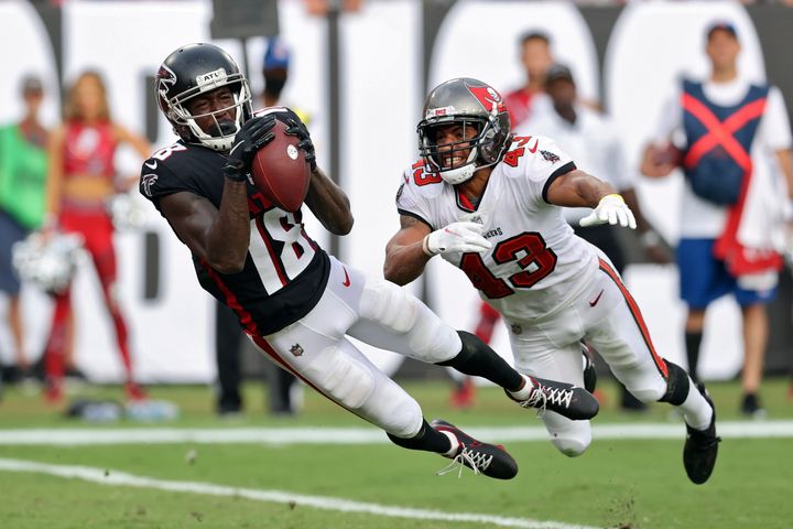 Atlanta Falcons wide receiver Calvin Ridley (18) makes a diving touchdown reception in front of Tampa Bay Buccaneers defensive back Ross Cockrell (43) during the second half of an NFL football game Sunday, Sept. 19, 2021, in Tampa, Fla. Falcons wide receiver Calvin Ridley has been suspended for the 2022 season for betting on NFL games in the 2021 season. The suspension announced by NFL commissioner Roger Goodell on Monday, March 7, 2022, is for activity that took place while Ridley was away from the team while addressing mental health concerns.