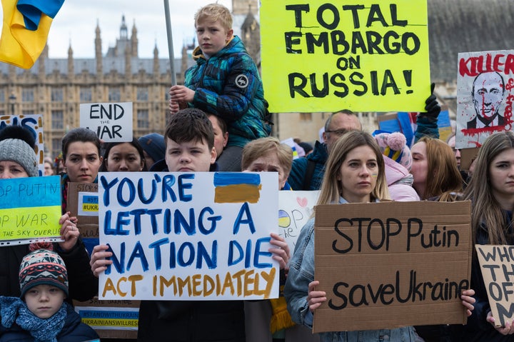 Ukrainian people and their supporters demonstrate in Parliament Square calling on the British government to support Ukraine and its refugees