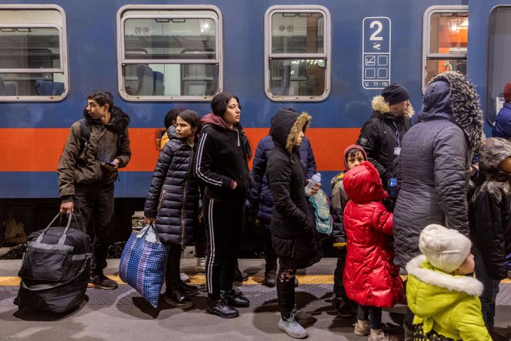 People arrive to the Western Railway Station from Zahony after crossing the border at Zahony-Csap as they flee Ukraine on March 7, 2022 in Budapest, Hungary.