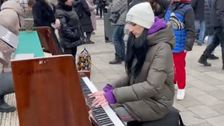 

    Pianist Plays ‘What A Wonderful World' Outside Ukraine Train Station In ‘Hauntingly Beautiful’ Video

