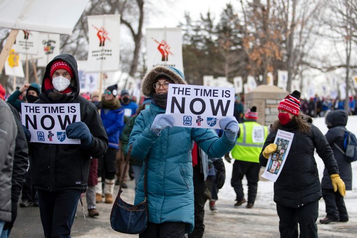 Twin Cities teachers and their supporters brave sub-zero temperatures Saturday, Feb. 12, 2022, to march in Minneapolis. (Hannah Hobus/Pioneer Press via AP)