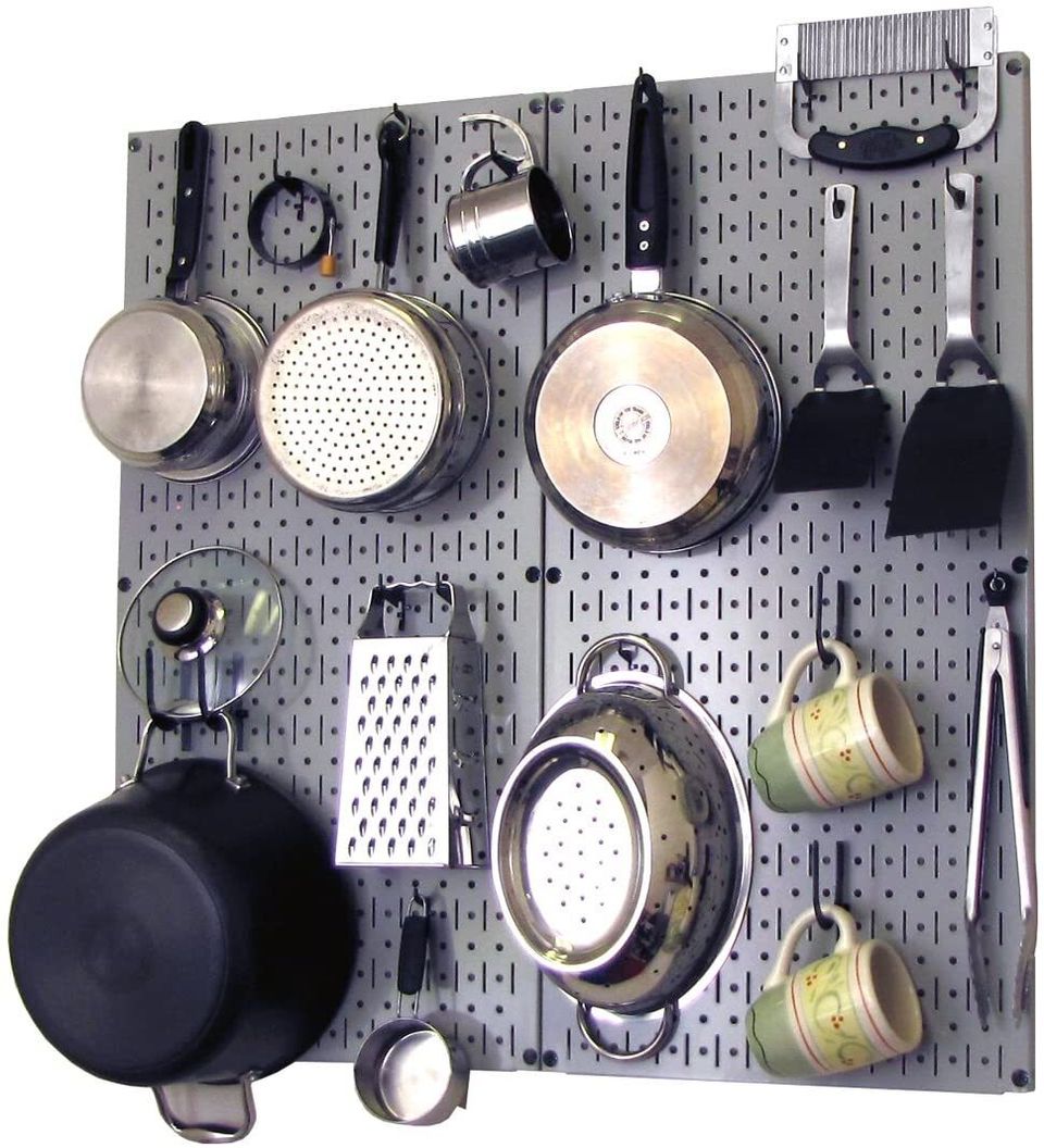A colorful metal pegboard with 1/4 inch holes