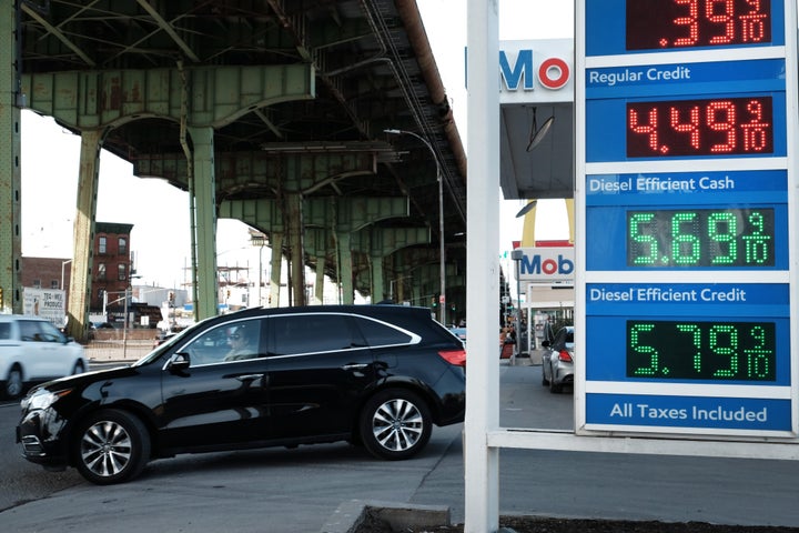 Prices are displayed at a gas station on March 8 in Brooklyn, New York. Gas prices are at record highs around the country as the Russian invasion of Ukraine causes global oil markets to surge.