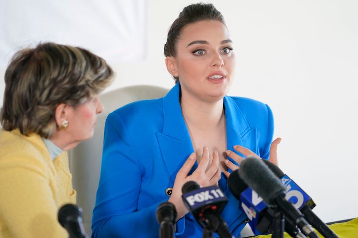 Veronika Didusenko, Miss Ukraine 2018, describes how she was forced to flee from Ukraine with her 7-year-old son, during a news conference at the office of her women’s rights attorney Gloria Allred, in Los Angeles. (AP Photo/Damian Dovarganes)