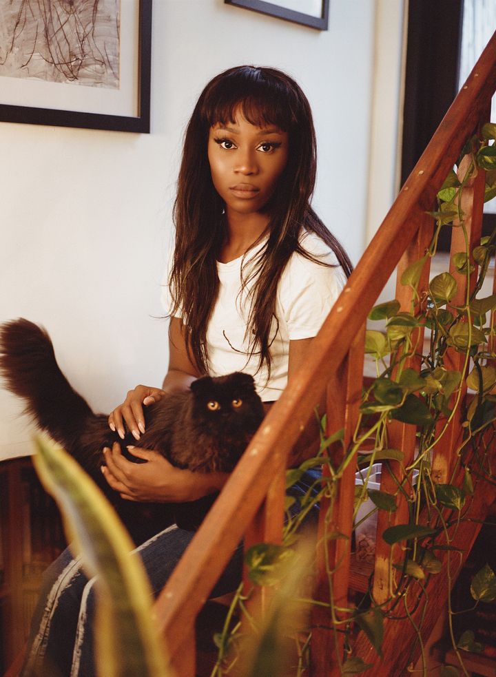 Vanniall with GMO, one of her three black cats.