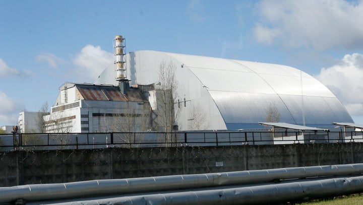 A shelter construction covers the exploded reactor at the Chernobyl nuclear plant, in Chernobyl, Ukraine, on April 27, 2021.