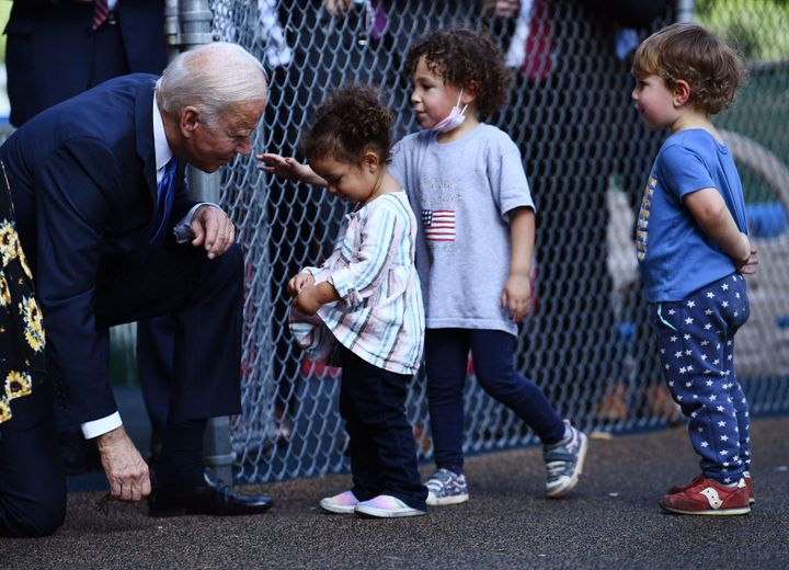 President Joe Biden greets children at the Capitol Child Development Center in Hartford, Connecticut, on Oct. 15, 2021.