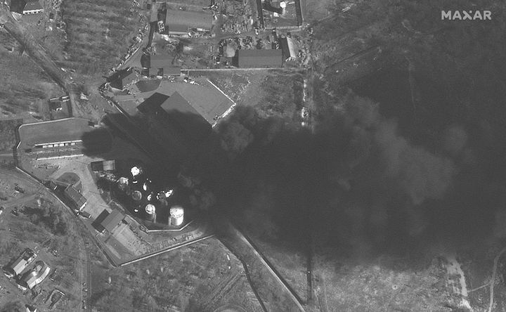 This satellite image shows fires at the fuel storage area at Antonov Airport in Hostomel, Ukraine on Thursday.