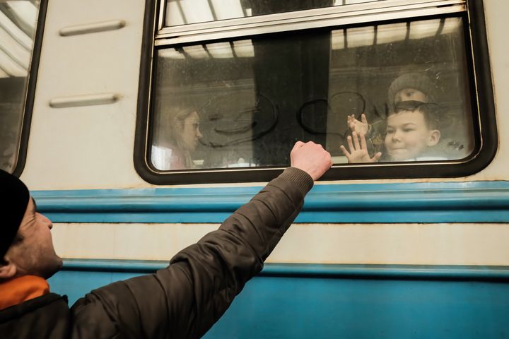 A Ukrainian refugee says goodbye to his family as the train prepares to depart. Since the beginning of the Russian invasion of Ukraine, around 2 million refugees have fled from their homes and crossed to Poland and other neighboring countries.