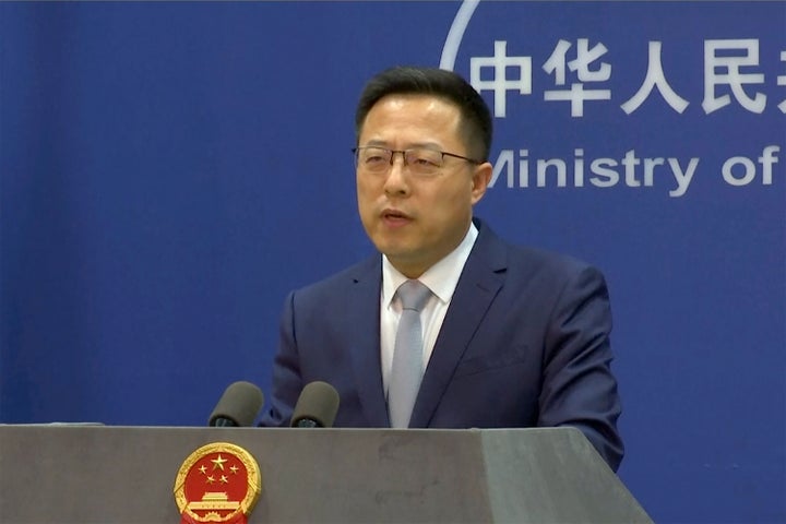 In an image taken from video, Chinese Foreign Ministry spokesperson Zhao Lijian speaks during a media briefing on March 10, 2022, in Beijing.