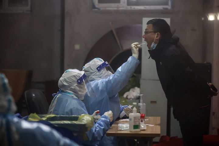 A resident undergoes a nucleic acid test for COVID-19 in Changchun in China's northeastern Jilin province on March 11, 2022.