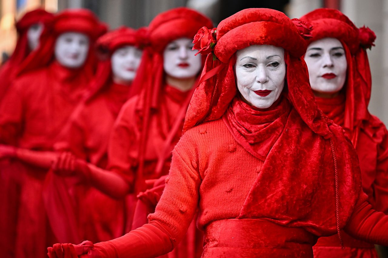 Red Rebels walk down the Royal Mile to join activists attending a vigil and rally for International Day of Women’s Climate Action, organised by the Women’s Climate Strike, to protest against the disproportionate impacts of climate disruption on women on Tuesday in Edinburgh, Scotland.