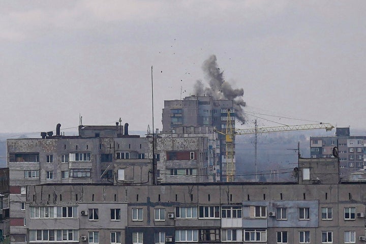 Explosions are seen during shelling in a residential district in Mariupol.