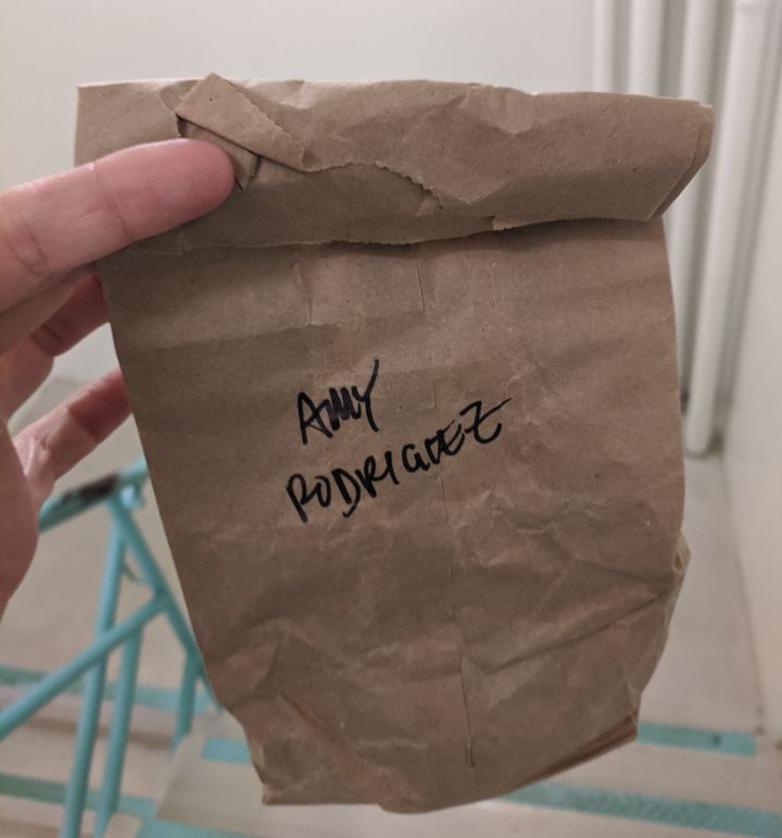 The author's best friend, who is also a doctor, used this brown paper bag to store the N95 mask she had to reuse while working because there were not enough resources to allow for a new mask during every shift.