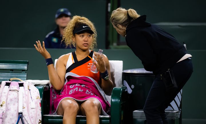 Osaka speaks with referee Clare Wood after being heckled by a fan at the Indian Wells Tennis Garden on Saturday.