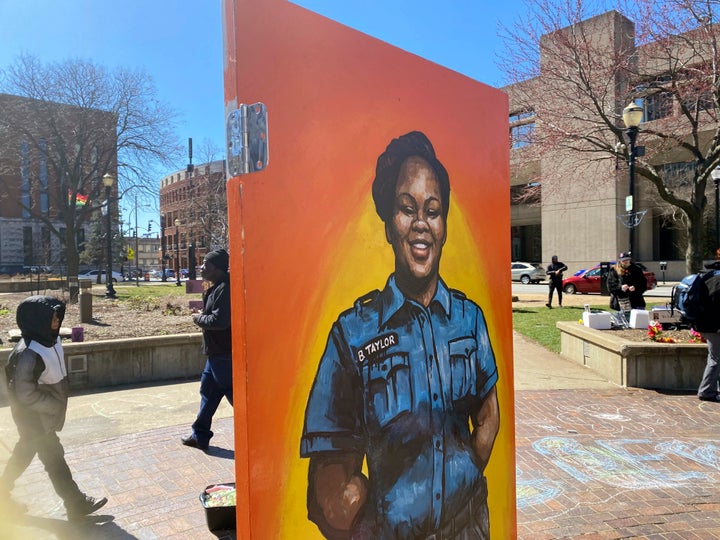 A painting of Breonna Taylor is among the art pieces decorating the center of Jefferson Square Park in Louisville, Ky., for a memorial on the two-year anniversary of Taylor's death, on March 13, 2022.