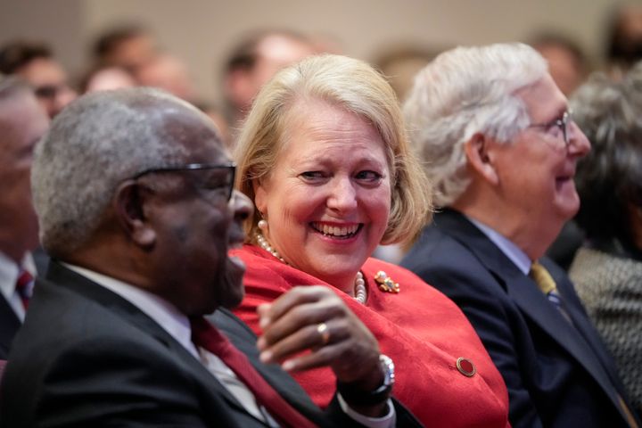 Supreme Court Justice Clarence Thomas sits with his wife and conservative activist Virginia Thomas while he waits to speak at the Heritage Foundation on Oct. 21, 2021.