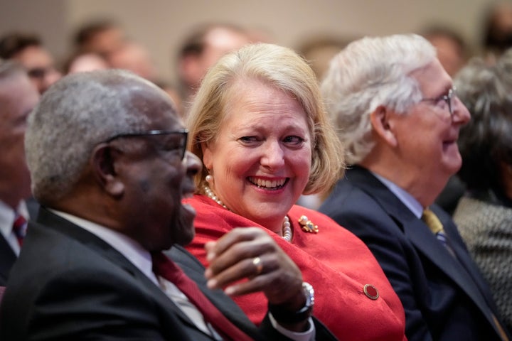 Supreme Court Justice Clarence Thomas sits with his wife and conservative activist Virginia Thomas while he waits to speak at the Heritage Foundation on Oct. 21, 2021.