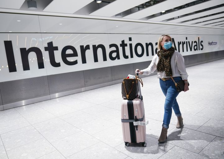 Passengers arrive at Heathrow Airport Terminal 5, London.