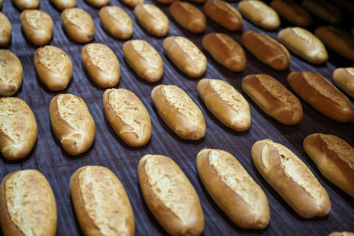 Freshly baked loaves of bread are seen at a production line at Istanbul Municipality's People's Bread factory in Istanbul, Turkey, December 7, 2021. Picture taken December 7, 2021. REUTERS/Umit Bektas