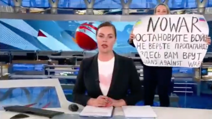The OVD-Info website that monitors political arrests said a Channel 1 employee was taken into police custody after she crashed the evening news to protest against the war.
