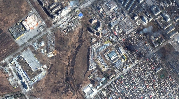 A satellite image shows a natural color overview of damage and fires burning in Prymorskyi district of western Mariupol, Ukraine on Monday.