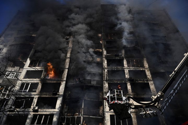 Firemen work to extinguish a fire that broke out in an apartment building hit by shelling in Kyiv on March 15, 2022.