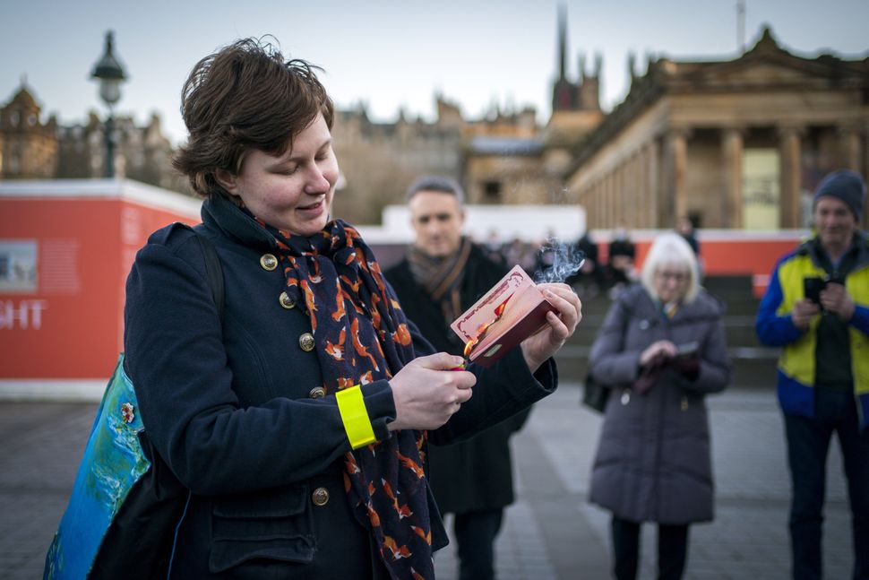 Anna Jakubova set fire to her Russian passport during the Standing In Solidarity With Ukraine vigil in Edinburgh. 