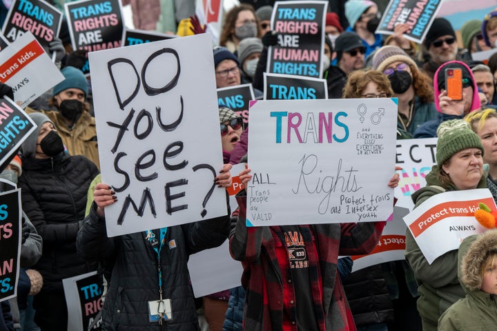 People hold a rally at the Minnesota state Capitol on March 6 to support transgender kids in Minnesota, Texas and elsewhere.