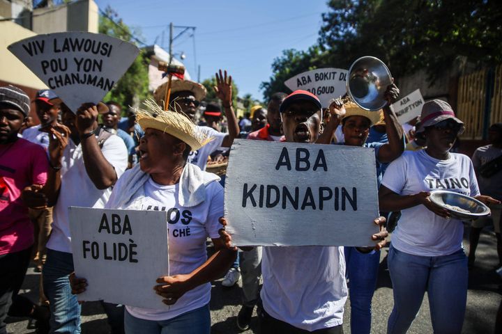 People protest against the country's spike in kidnappings and gang-aggravated fuel crisis in Port-au-Prince, Haiti on Nov. 18, 2021. 